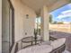 Relaxing covered patio with seating area, overlooking a spacious backyard at 6316 W Gowan Rd, Las Vegas, NV 89108