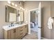 Bathroom with double vanity and view of bedroom at 6316 W Gowan Rd, Las Vegas, NV 89108