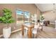 Bright dining room with hardwood floors and large window at 6316 W Gowan Rd, Las Vegas, NV 89108