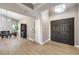 Bright entryway with double doors and wood-look flooring at 6316 W Gowan Rd, Las Vegas, NV 89108