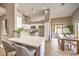 Modern kitchen with white cabinets and breakfast bar at 6316 W Gowan Rd, Las Vegas, NV 89108