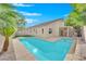 Inviting backyard oasis featuring a sparkling pool and spa at 7832 Red Leaf Dr, Las Vegas, NV 89131