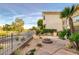 Landscaped backyard with a fire pit and a view of the golf course at 9112 Eagle Ridge Dr, Las Vegas, NV 89134