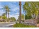 Gated community entrance with signage and lush landscaping at 9112 Eagle Ridge Dr, Las Vegas, NV 89134