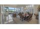 Bright dining room features a wood table and leather chairs, with access to the living room and large windows at 9112 Eagle Ridge Dr, Las Vegas, NV 89134