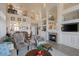 Two-story living room with fireplace and high ceilings at 9112 Eagle Ridge Dr, Las Vegas, NV 89134