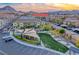 Aerial view of townhomes showcasing a playground and green space at 965 Nevada State Dr # 1101, Henderson, NV 89002