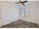 Bedroom with gray carpet, ceiling fan and window at 965 Nevada State Dr # 1101, Henderson, NV 89002