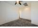 Spacious bedroom with grey carpet and ceiling fan at 965 Nevada State Dr # 1101, Henderson, NV 89002