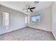 Bright bedroom featuring carpet, ceiling fan and window at 965 Nevada State Dr # 1101, Henderson, NV 89002