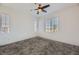 Well-lit bedroom with gray carpet and multiple windows at 965 Nevada State Dr # 1101, Henderson, NV 89002