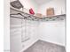 Neat closet with shelving, hanging rods, neutral carpet and white walls, great for storage at 965 Nevada State Dr # 1101, Henderson, NV 89002