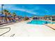 Beautiful community pool with clear blue water, lounge chairs, and umbrellas for a relaxing experience at 965 Nevada State Dr # 1101, Henderson, NV 89002