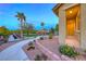 Serene townhome exterior with community picnic tables, and lush landscaping at 965 Nevada State Dr # 1101, Henderson, NV 89002