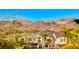 Exterior home view with mountain landscape background showcasing community design at 965 Nevada State Dr # 1101, Henderson, NV 89002