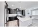 Modern kitchen featuring black cabinets, white quartz countertops and stainless appliances at 965 Nevada State Dr # 1101, Henderson, NV 89002