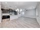 Modern kitchen with quartz countertops, black cabinets, and stainless steel refrigerator at 965 Nevada State Dr # 1101, Henderson, NV 89002