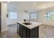 Modern kitchen with dark island, cabinetry, and tile floors at 965 Nevada State Dr # 1101, Henderson, NV 89002