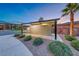 View of the mailboxes for the community with a palm tree on a clear evening at 965 Nevada State Dr # 1101, Henderson, NV 89002