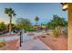 Community playground featuring picnic benches, lush greenery, and playground equipment at 965 Nevada State Dr # 1101, Henderson, NV 89002