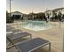 Community pool with plenty of lounge chairs at 965 Nevada State Dr # 1101, Henderson, NV 89002