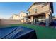 Spacious backyard with artificial turf and a covered patio at 361 Andy Wheeler Dr, Henderson, NV 89011