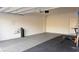 Garage with epoxy flooring and home gym setup at 361 Andy Wheeler Dr, Henderson, NV 89011