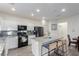 Well-lit kitchen with white cabinets, modern appliances, and a spacious central island at 361 Andy Wheeler Dr, Henderson, NV 89011