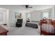 Main bedroom with light gray walls, neutral carpet, and seating at 361 Andy Wheeler Dr, Henderson, NV 89011