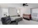 Main bedroom with light gray walls, neutral carpet, and a ceiling fan at 361 Andy Wheeler Dr, Henderson, NV 89011