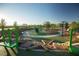 Modern playground with green turf and rock features at 361 Andy Wheeler Dr, Henderson, NV 89011