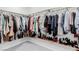 Walk-in closet featuring custom organizers and shelving for shoes at 361 Andy Wheeler Dr, Henderson, NV 89011