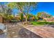 Spacious backyard with patio, artificial turf and seating area at 4129 Cackling Goose Dr, North Las Vegas, NV 89084