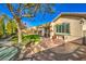 Backyard patio with outdoor kitchen and seating area at 4129 Cackling Goose Dr, North Las Vegas, NV 89084