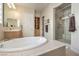 Spa-like bathroom with soaking tub and walk-in shower at 4129 Cackling Goose Dr, North Las Vegas, NV 89084