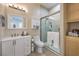 Updated bathroom with a walk-in shower, vanity, and toilet at 4129 Cackling Goose Dr, North Las Vegas, NV 89084