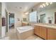 Elegant bathroom with double sinks and soaking tub at 4129 Cackling Goose Dr, North Las Vegas, NV 89084