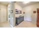 Bright entryway with tile flooring, storage, and an accent cabinet at 4129 Cackling Goose Dr, North Las Vegas, NV 89084