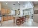 Open concept kitchen with island and granite countertops at 4129 Cackling Goose Dr, North Las Vegas, NV 89084