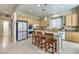 Modern kitchen with stainless steel appliances and light wood cabinets at 4129 Cackling Goose Dr, North Las Vegas, NV 89084