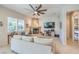 Comfortable living room featuring a fireplace and ceiling fan at 4129 Cackling Goose Dr, North Las Vegas, NV 89084