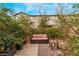 Enchanting backyard patio area surrounded by greenery and foliage at 5372 Silver Branch Ave, Las Vegas, NV 89118