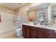 Bathroom with double sink vanity, shower and toilet at 5372 Silver Branch Ave, Las Vegas, NV 89118