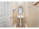 Cozy half bathroom with a pedestal sink and neutral wall color at 5372 Silver Branch Ave, Las Vegas, NV 89118