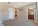 Neutral bedroom with carpet, walk-in closet, and an en-suite bathroom at 5372 Silver Branch Ave, Las Vegas, NV 89118