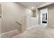 Upstairs hallway with neutral colored carpet and access to bedrooms and bathrooms at 5372 Silver Branch Ave, Las Vegas, NV 89118