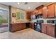 Bright kitchen with stainless steel appliances and granite counters, sliding door at 5372 Silver Branch Ave, Las Vegas, NV 89118