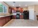 Well-equipped kitchen featuring granite countertops and modern appliances at 5372 Silver Branch Ave, Las Vegas, NV 89118