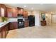 Spacious kitchen with sleek black appliances and stylish cabinetry at 5372 Silver Branch Ave, Las Vegas, NV 89118