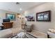 Cozy living area with artwork, tile flooring, and stairs at 5372 Silver Branch Ave, Las Vegas, NV 89118